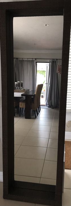 6 1/2 ‘ Tall Dark Rattan mirror 