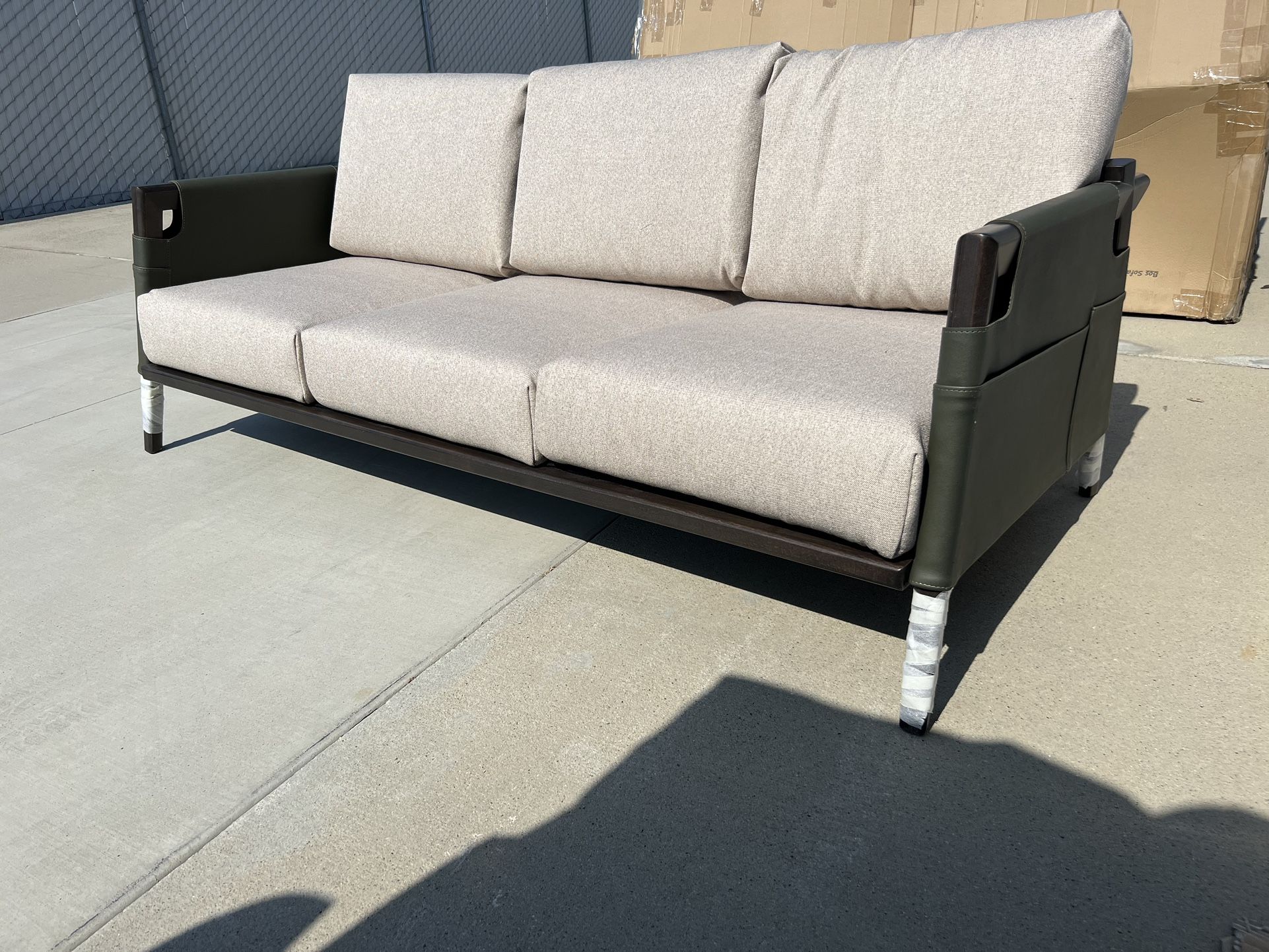 Brand New. Vegan leather/wood frame sofa. Retails Over $1620