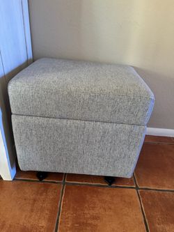 Grey gliding ottoman
