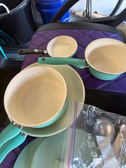 The green pan set and flatware