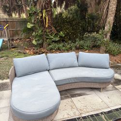 outdoor Blue couch with a light brown finish
