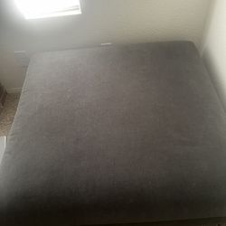 blue square ottoman with black legs 
