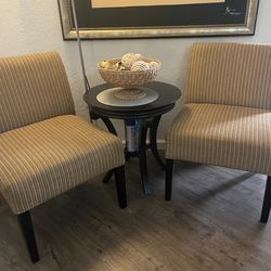 Two living room chairs, and two side tables