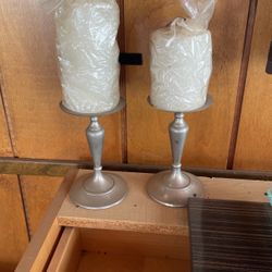 Silver candleholders with candle