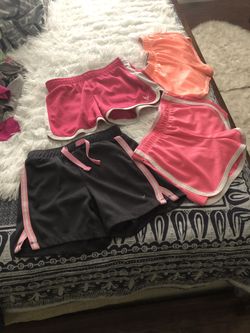 4 pieces girls shorts sizes 7-8 and 10 from justice in good condition