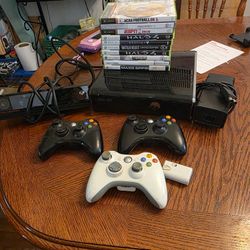 Xbox 360 with controllers and games