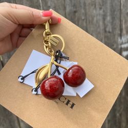 Coach cherry Charm Bag 