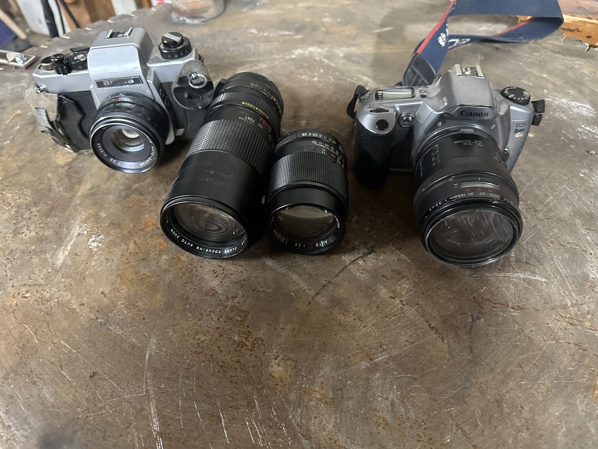 (2) 35mm film cameras with lenses