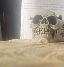 Skeleton Head With Nail In His Head