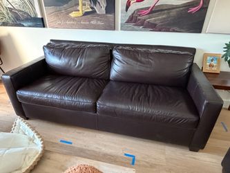 Two West Elm Henry leather couches will sell separately