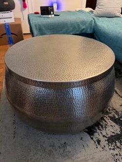 Hammered metal coffee table with storage