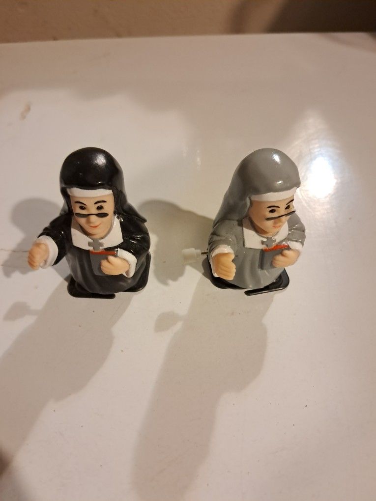 Pair Of Wind Up Nuns