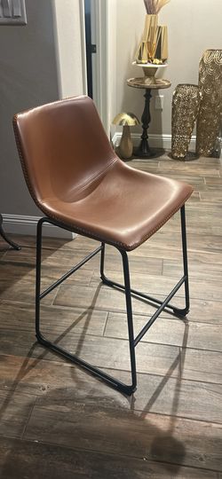 Stylish black Or Brown leather bar stool with metal frame.