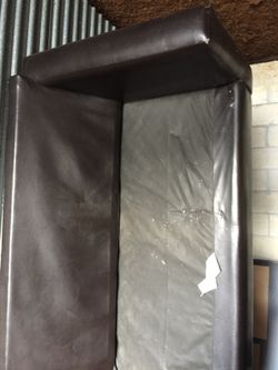 Leather type sofa missing bottom cushions