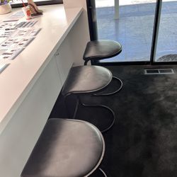 Three Black Bar Stool Seats
