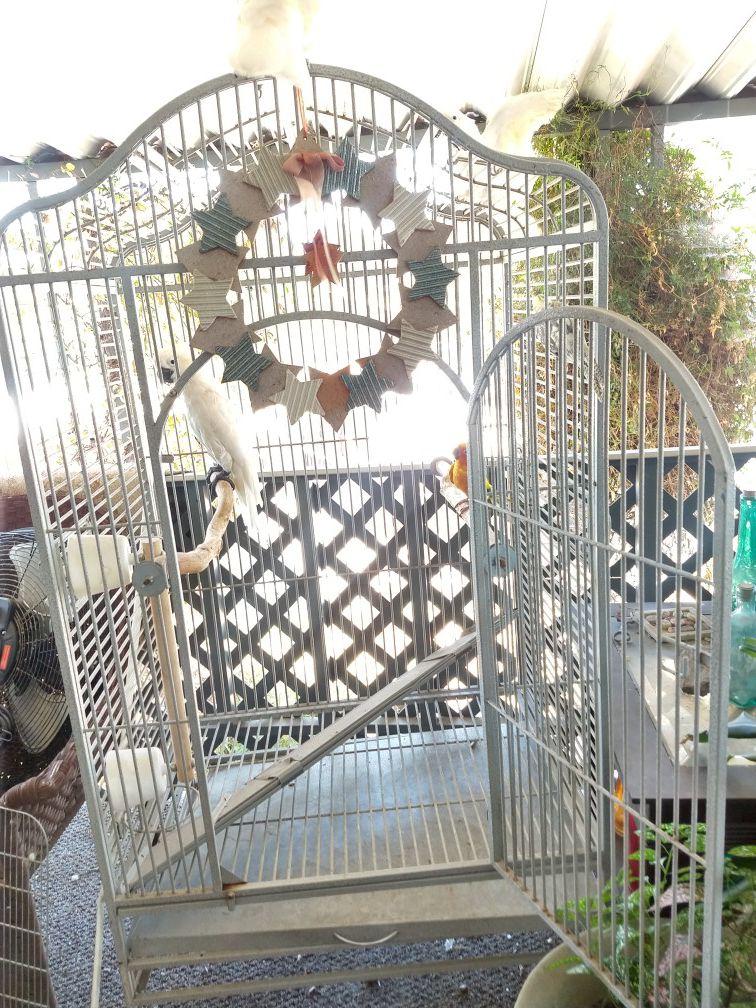 Large white bird cage like new on wheels opens up at top