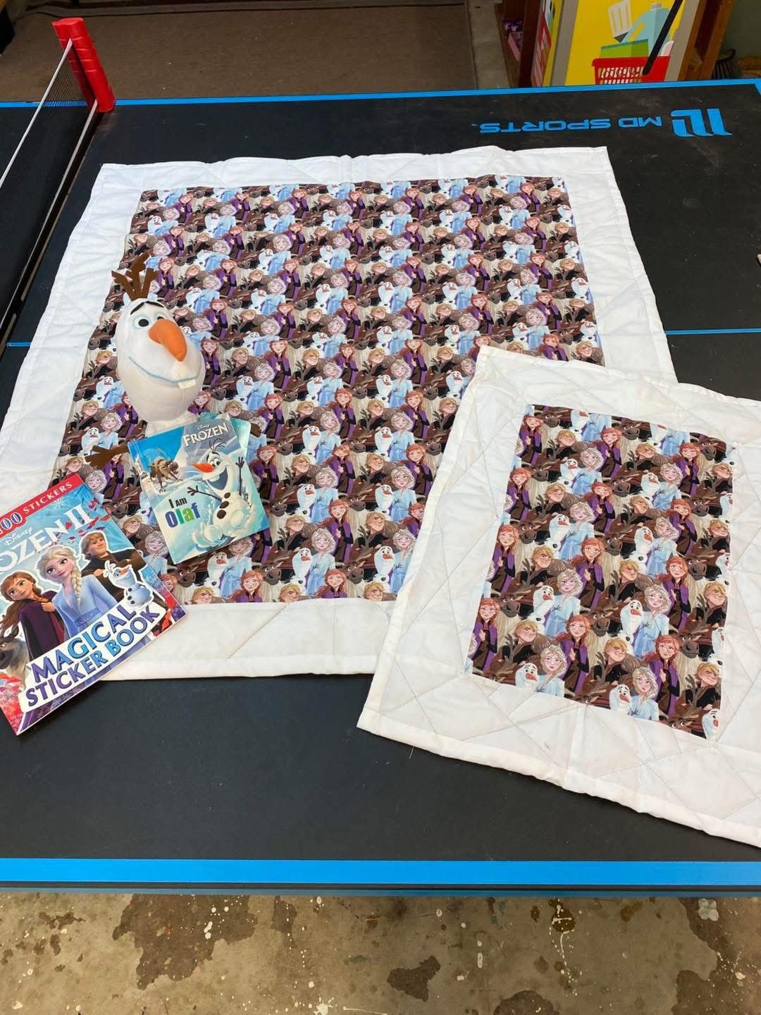 New hand quilted Frozen lap blanket, new Olaf plush and book and small blanket for Olaf, new sticker book. Easter gift basket