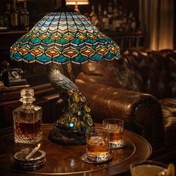 Large Tiffany-style peacock lamp with beautiful stained glass shade.