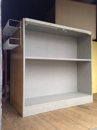 3 packing stands. Cutting board surfaces. Storage shelves.