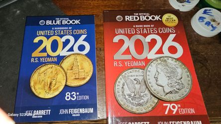 Both red and blue books of coins for 2026