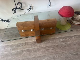 Glass table, solid wood base.