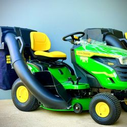 Brand new John Deere S120 42 in. 22 HP V-Twin Gas Hydrostatic Riding Lawn Mower comes with bagger. 