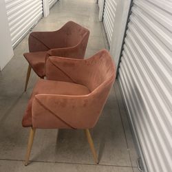 Two pink desk chairs
