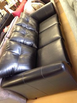 New black leather sofa