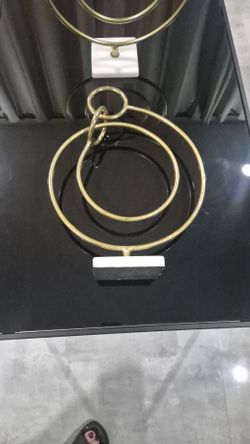 Two Gold Metal Ring Sculpture with Marble Base