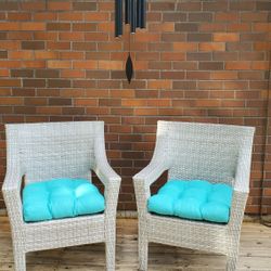 2 Light gray resin rattan outdoor club chairs (cushions not included)