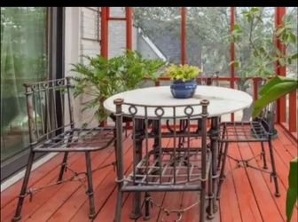 Patio table set with marble top and 4 chairs with 4 cushions