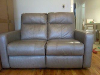 Taupe leather reclining loveseat sofa for two