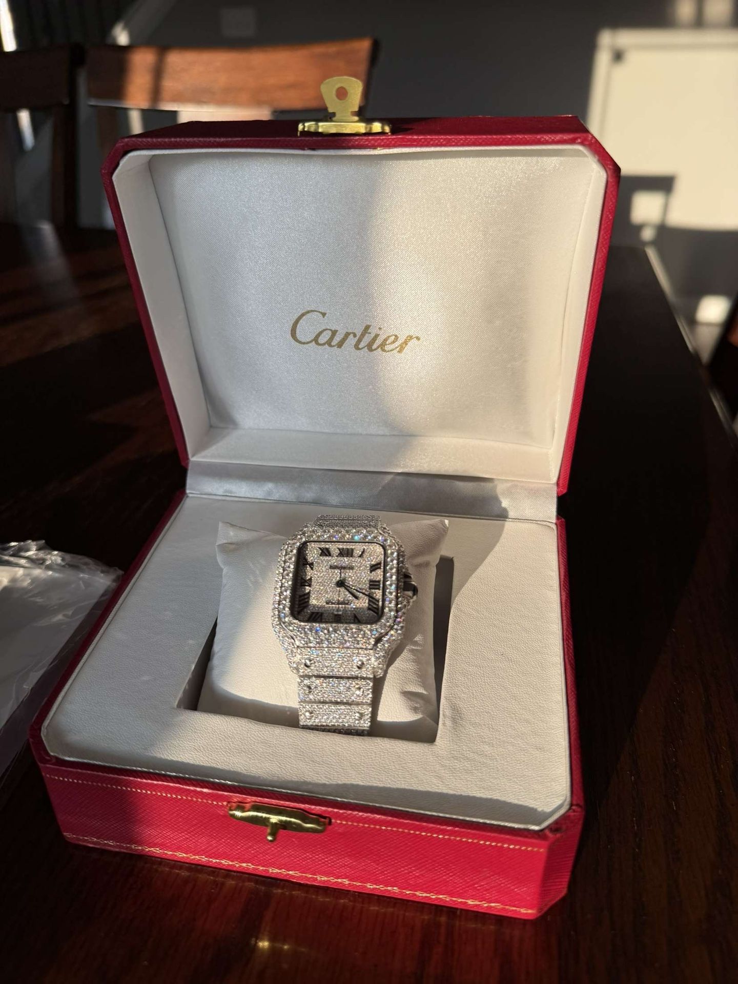 Iced out Cartier watch
