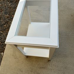 Set of white end tables with glass insert and storage shelf