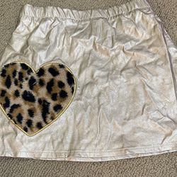  365 Kids Girls Garanimals Skirt Size 7 Skirt With Heart Leopard Print Bottom.  85% Rayon  15% Polyester  Lining  100% Polyester  RN 15897  Color Gold