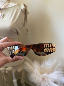 Miu Miu Tortoise Sunglasses with Gold Logo