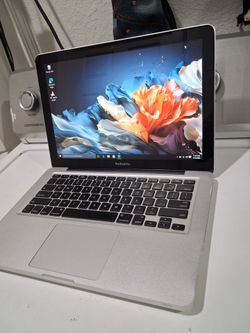 Macbook Pro laptop computer with  windows 10 installed.  Good condition.  15' screen.  intel Core 2 duo CPU processor.   wifi.  Webcam.  Bluetooth.  d