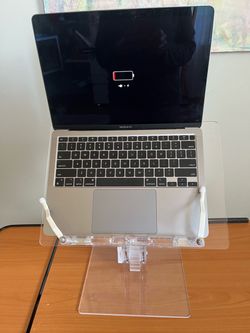 Adjustable acrylic computer stand. In San Francisco.