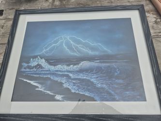 framed seascape print depicting a storm over the ocean, with dramatic lightning and crashing waves