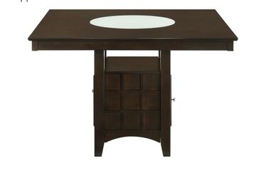 Dining table with cushioned chairs and matching Bar