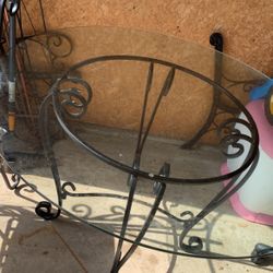 Round Metal Glass Table and Four Metal Armless Chairs with New Cushions  come look at before deciding