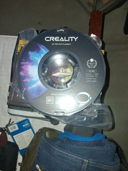 Brand new roll of grey/silver filament for 3d printing
