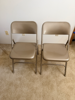 Pair of metal folding chairs