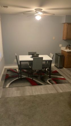 Five piece dining room set with rug