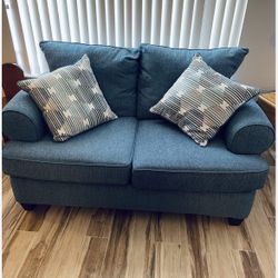 Free Delivery! Modern Blue 2 seater Sofa W/2 Pillows. Originally $800. Barely used from Petfree home