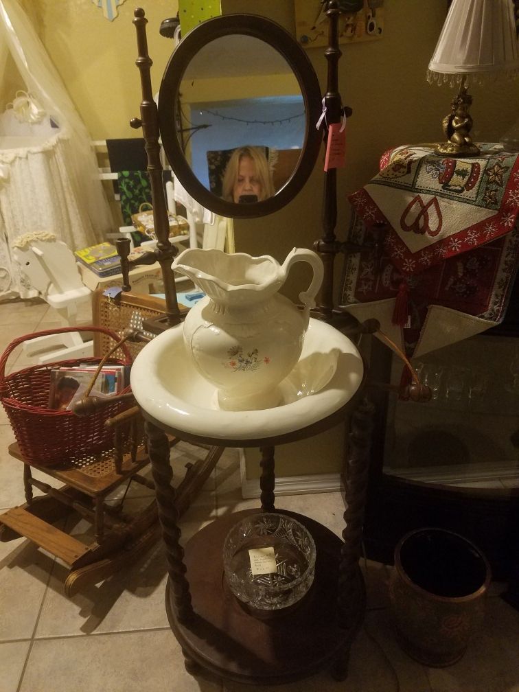 Antique washstand basin with mirror, candleholder in wood.