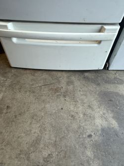 Base under compartment for washer and dryer Set