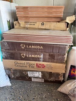 Assorted bathroom goods, small cabinet, Moen faucet, collection of floor tiles and backsplash