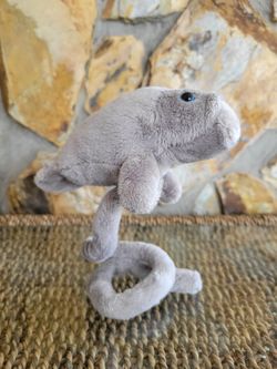 Gray Plush Manatee Toy With Blue Eyes