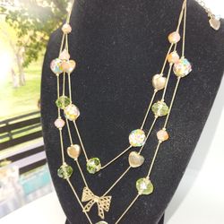BETSEY JOHNSON TRIPLE STRAND NECKLACE, GLASS STONES
